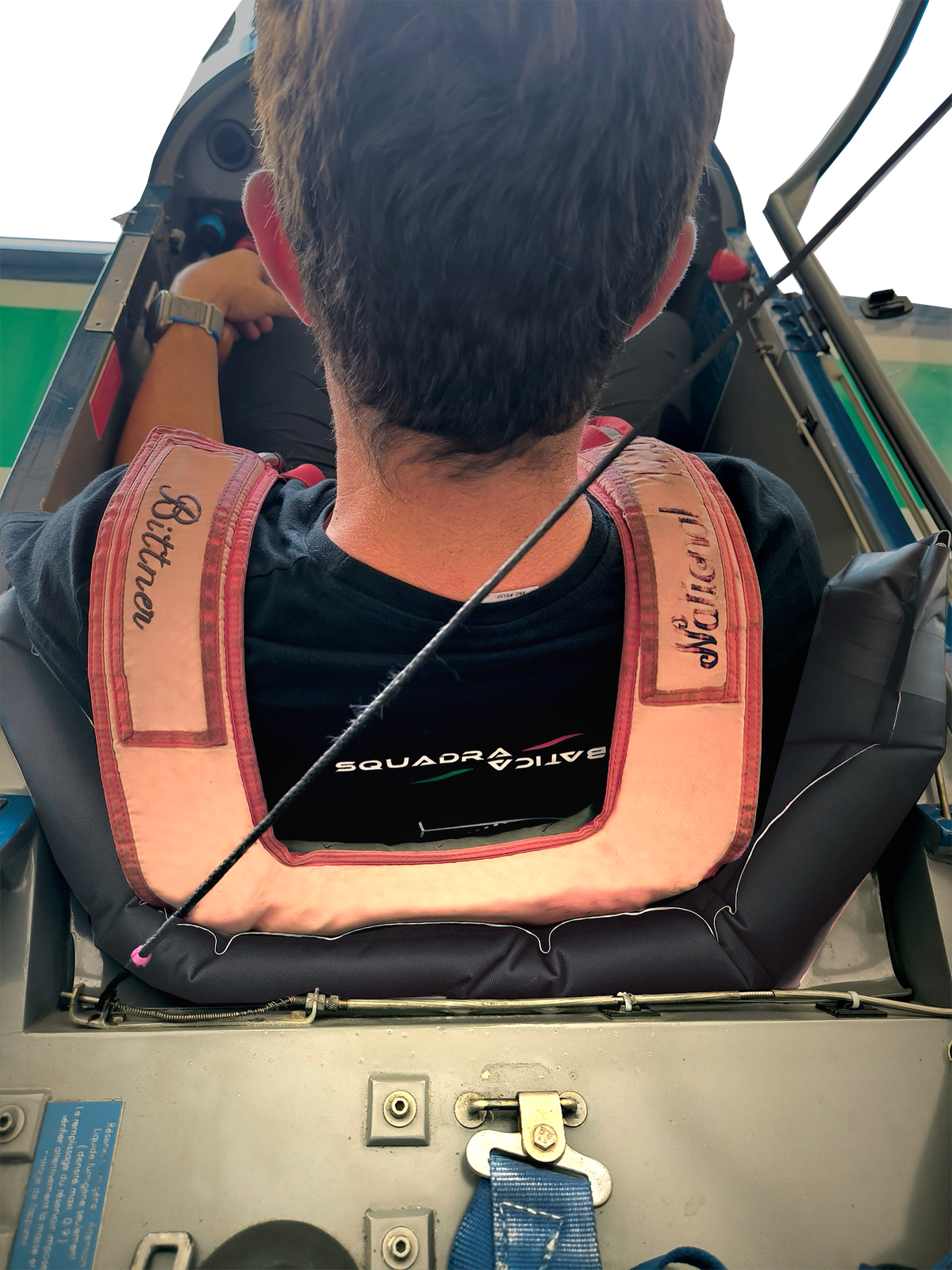 Pilot secured in TOTIM custom foam seat during aerobatic flight